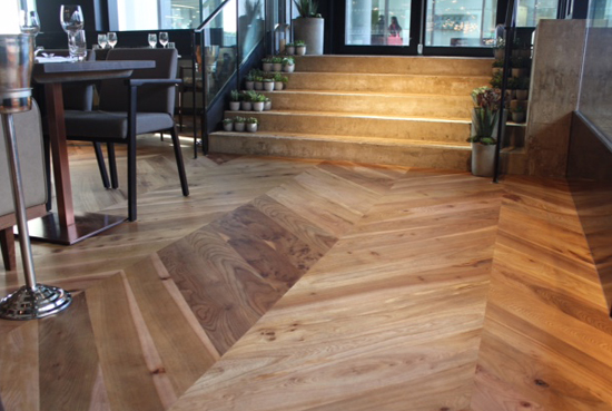 Interior photo of our bespoke elm flooring for London restaurant.