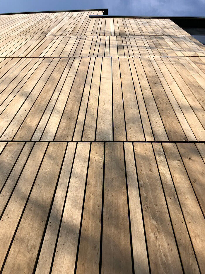 View up Brimstone cladding, in multiple widths on a sunny day